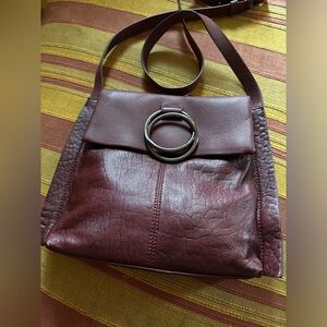 Vince Camuto cross body bag no scuffs clean interior no wear brownish burgundy